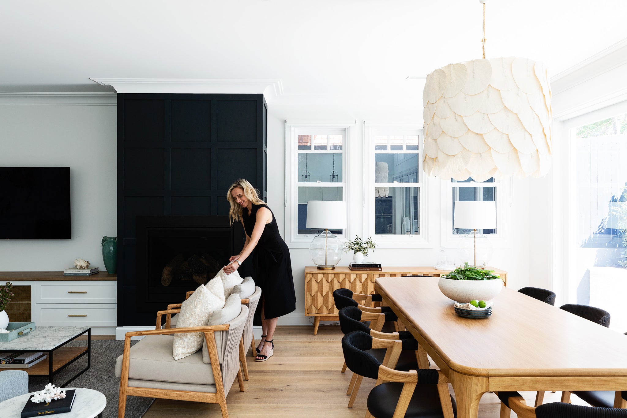 Interior stylist at work selecting and sourcing furniture, homewares and lighting in an Australian coastal home